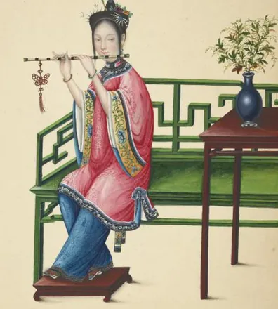 A woman in a pink robe sits on a green lattice bench and plays a side-blown dizi flute, a vase of flowers on the table beside her.