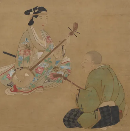 Beneath a branch of cherry blossom, a woman in a flowered kimono plays the shamisen while a seated man beside her accompanies on a bowed lute.