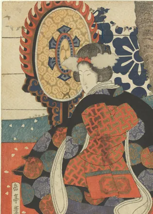 A woman in a richly patterned robe kneels beside a large hanging gagaku drum framed in carved flames.